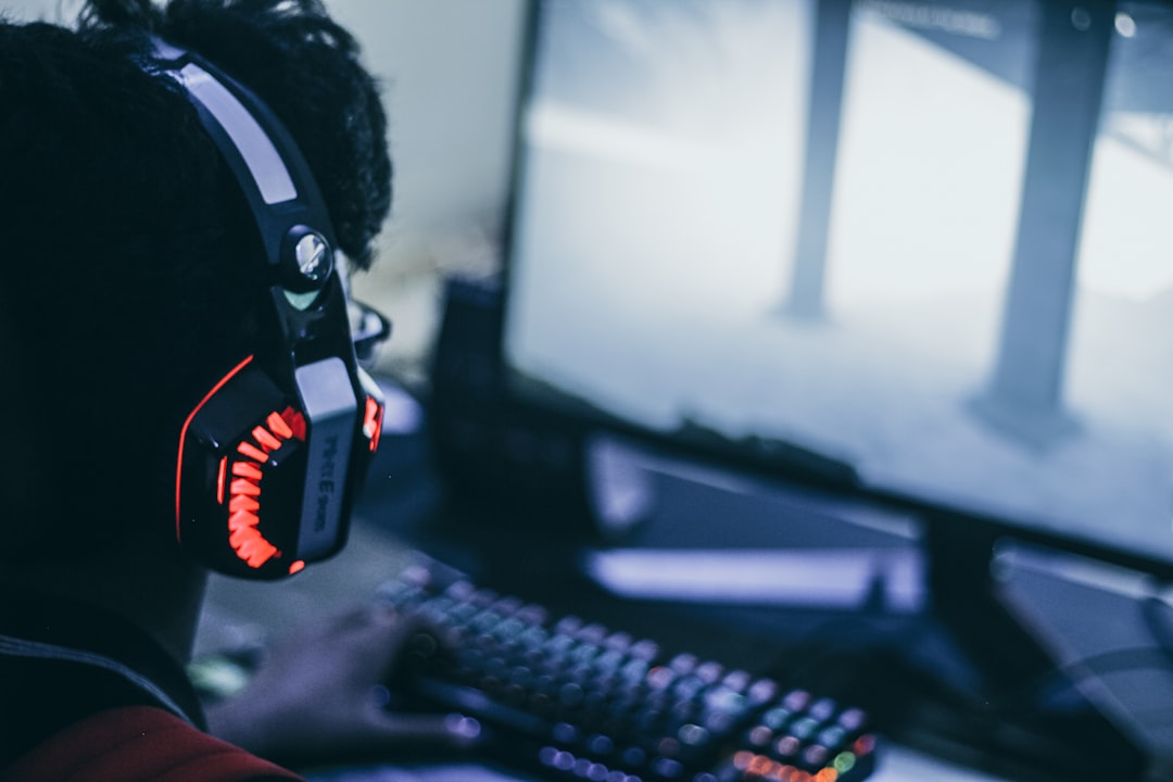 A clean and organized gaming setup with a computer, microphone, and streaming software on the screen, showcasing a professional streaming environment.