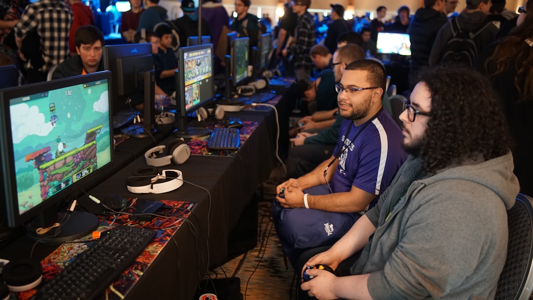 A focused gamer training with a headset and gaming setup, showcasing a competitive gaming environment.