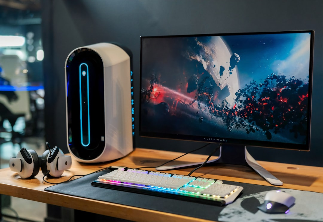 A modern gaming PC setup with a high-resolution monitor, keyboard, and gaming accessories in a stylish environment.