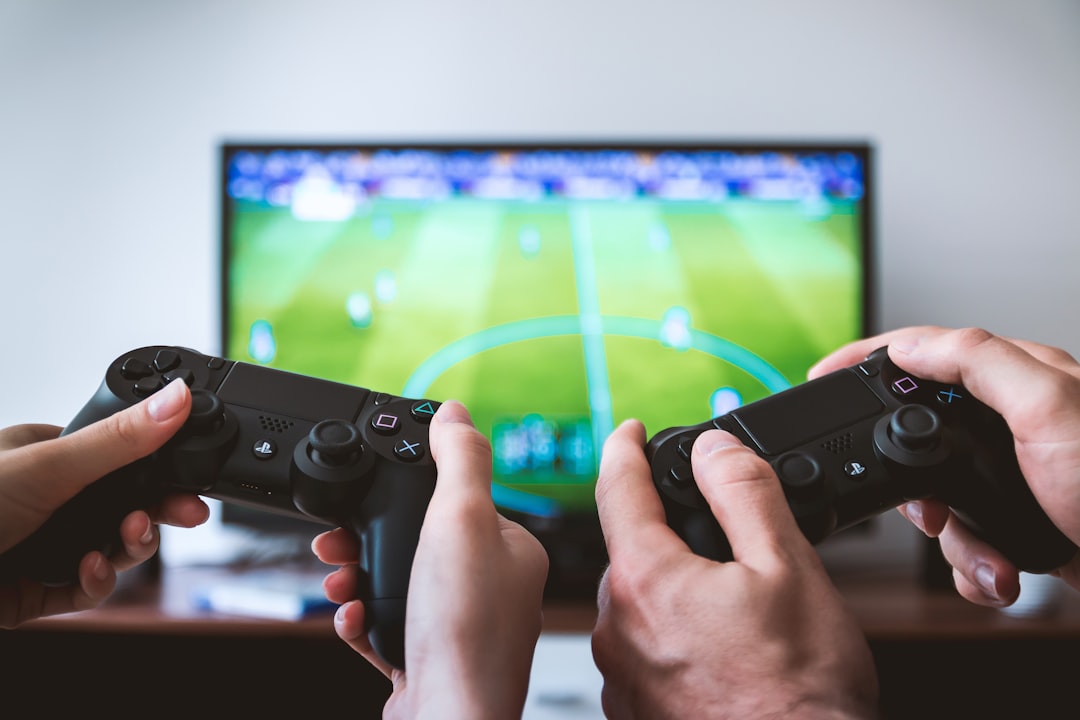 A focused gamer practicing skills on a computer, with a vibrant gaming setup and a determined expression.