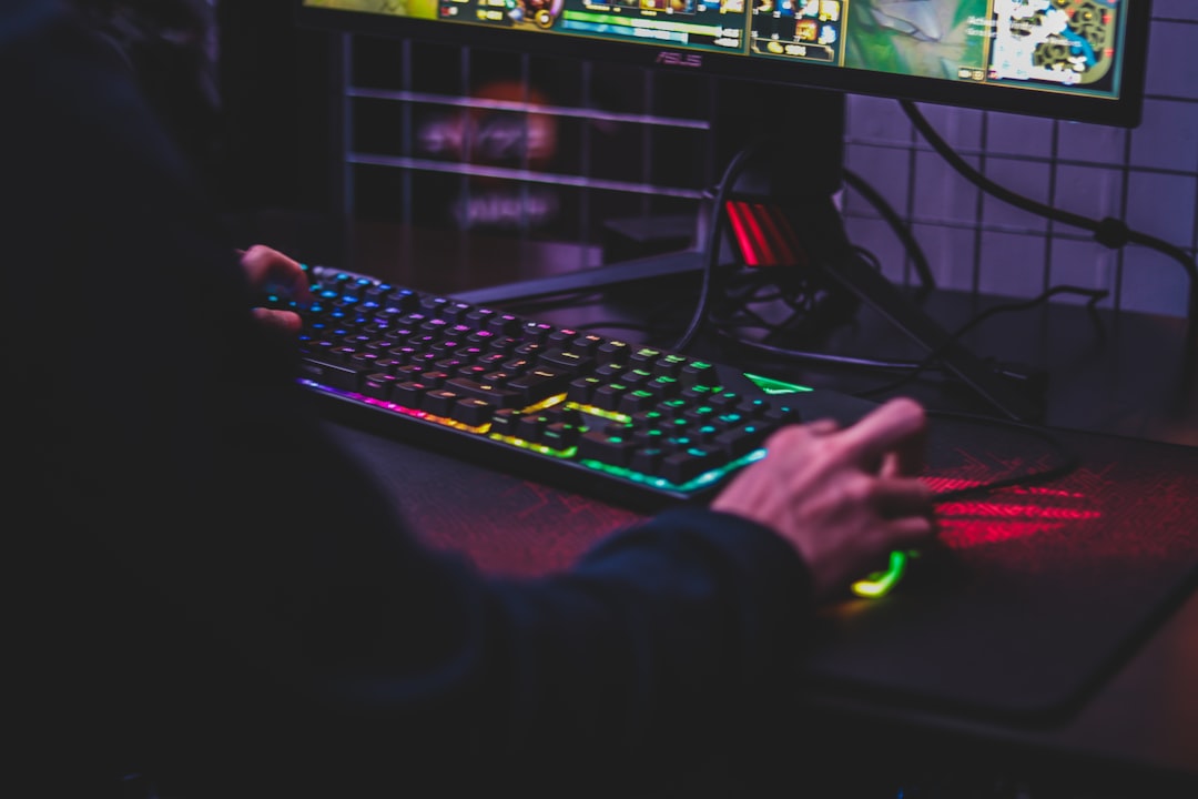 A tidy and organized gaming desk with a computer, console, and accessories neatly arranged, showcasing a comfortable and efficient gaming environment.
